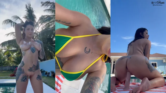 Sara Calixto inserts a dildo into her vagina in the swimming pool